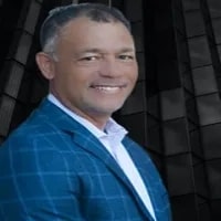 Paul_Moehring seen in blue color suit with white color shirt